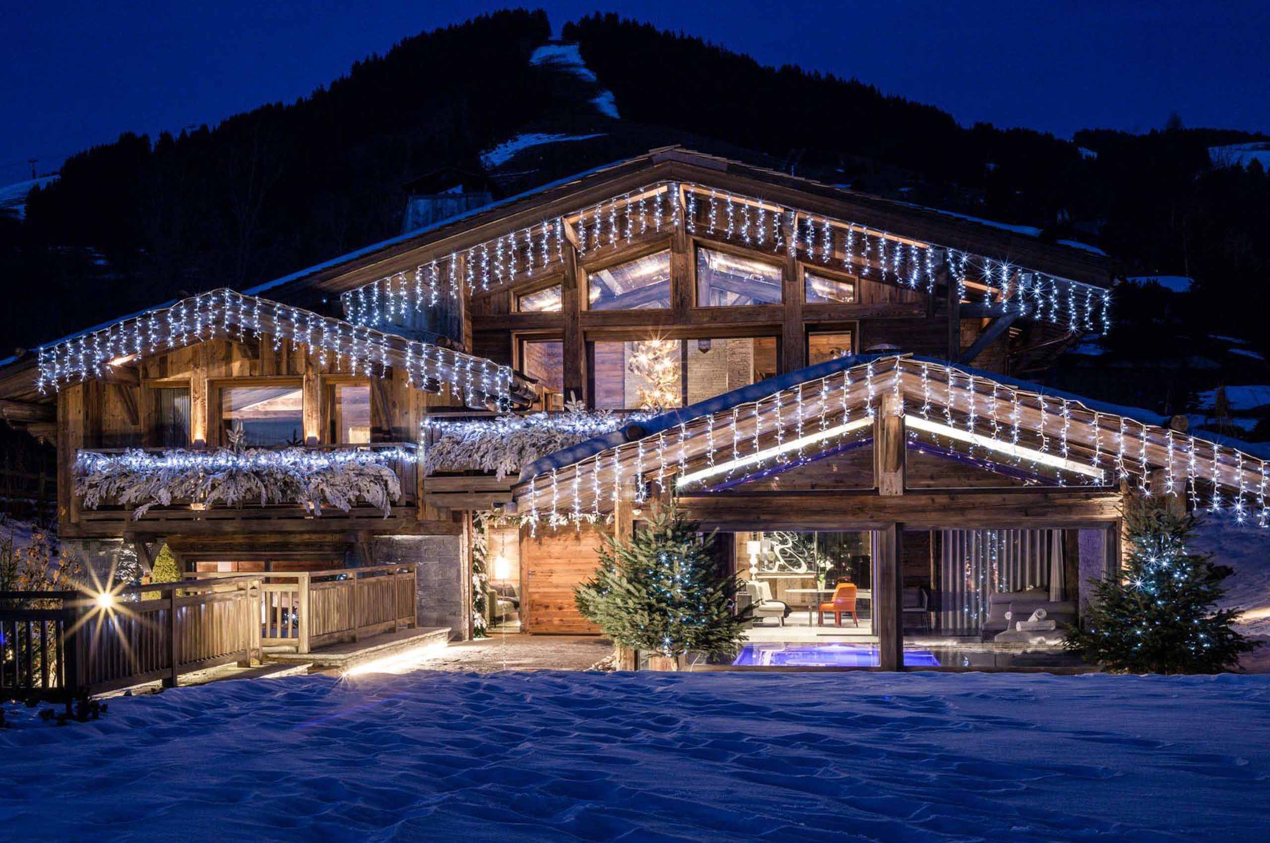 chalet-sabine-exterior-night-christmas-mountains-luxury-alpine-rental-retreat-megeve