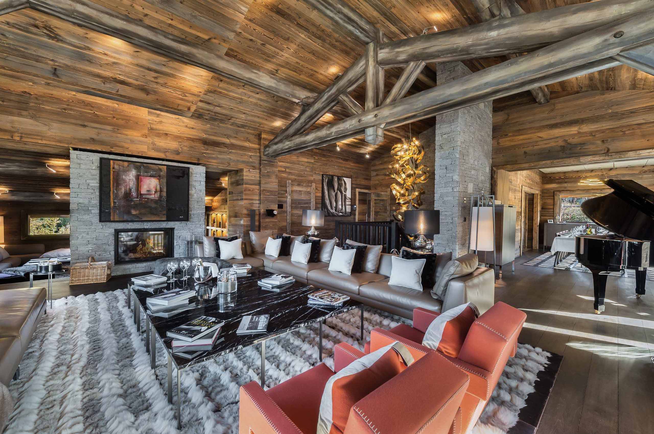 chalet-sabine-livingroom-piano-openplan-fireplace-cosy-alpine-luxury-design-megeve