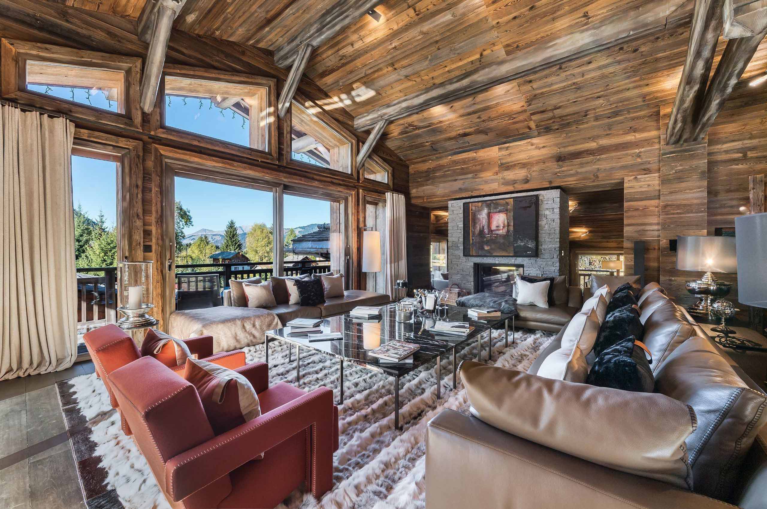chalet-sabine-mainpage-livingroom-large-spacious-openplan-highceiling-luxury-alpine-interior-megeve