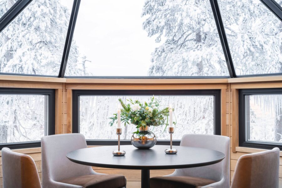 residence-indigo-diningroom-daytime-winter-skylight-bright-scenic-woodland-views-luxury-rental-retreat-lapland