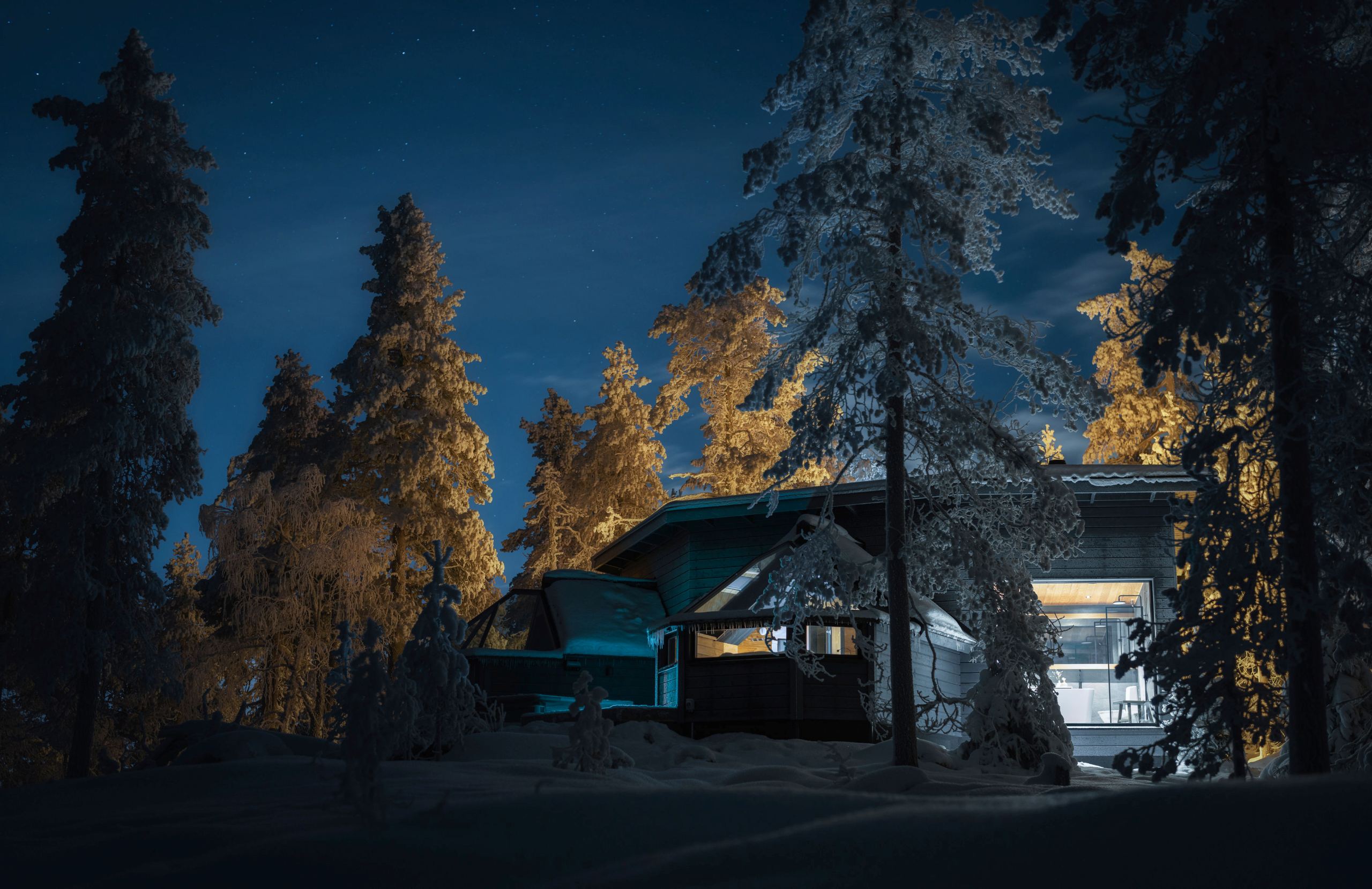 residence-indigo-exterior-night-winter-woodland-exclusive-rental-retreat-luxury-lapland