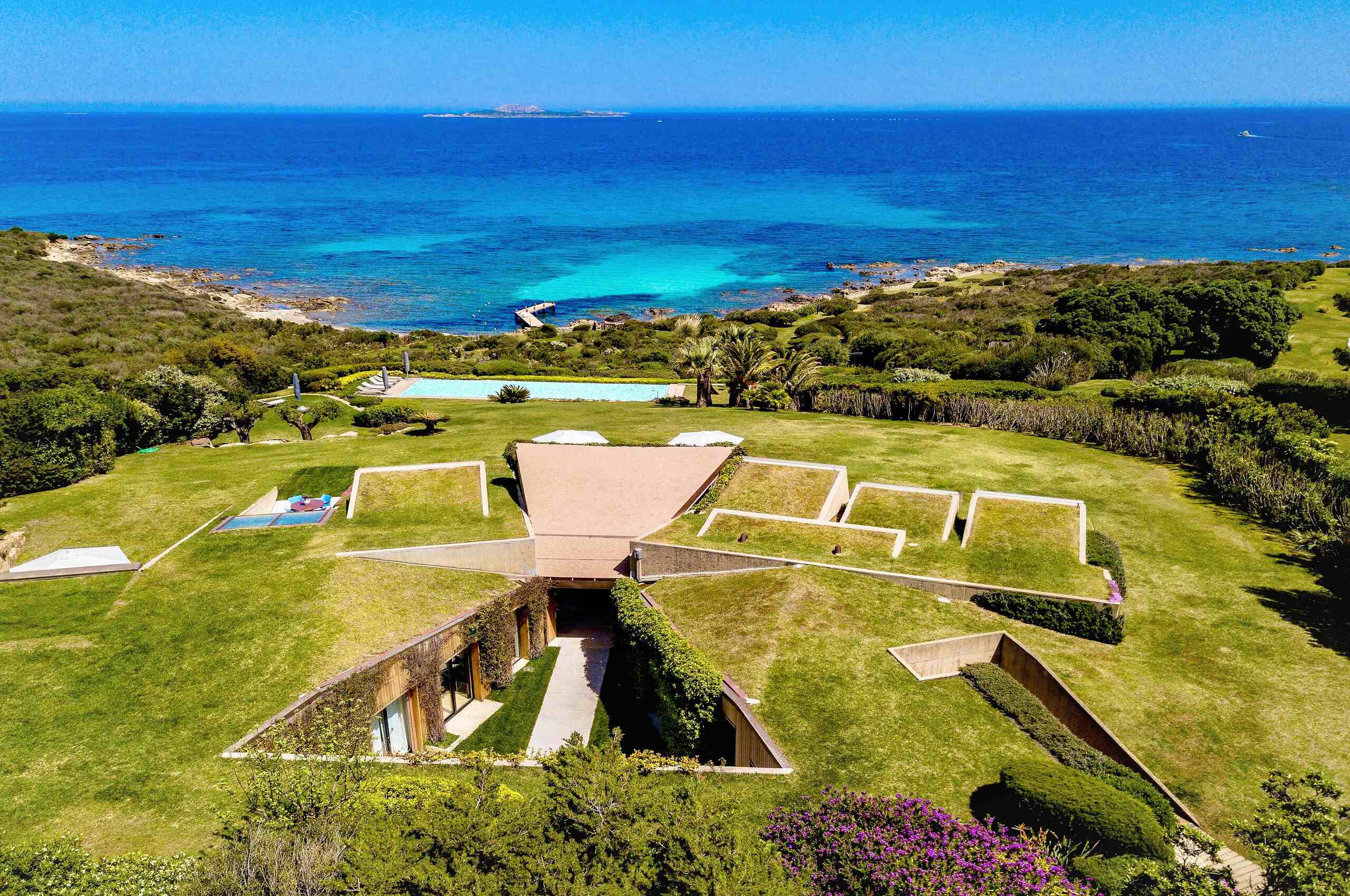 villa-cora-mainpage-unique-architecture-large-garden-stunning-seaviews-swimmingpool-beach-access-luxury-sardinia