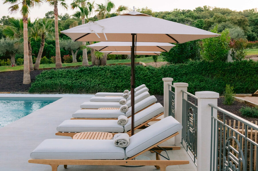 villa-corvina-sunbed-poolside-palmtrees-lacroixvalmer