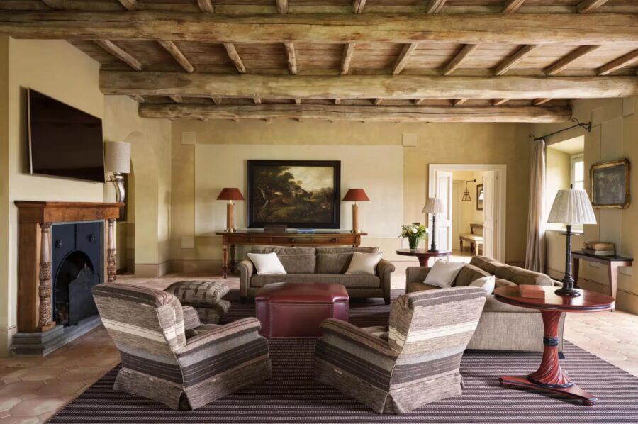 villa-iris-living-room-fireplace-wood-beamed-ceilings-elegant-traditional-design-luxury-tuscany