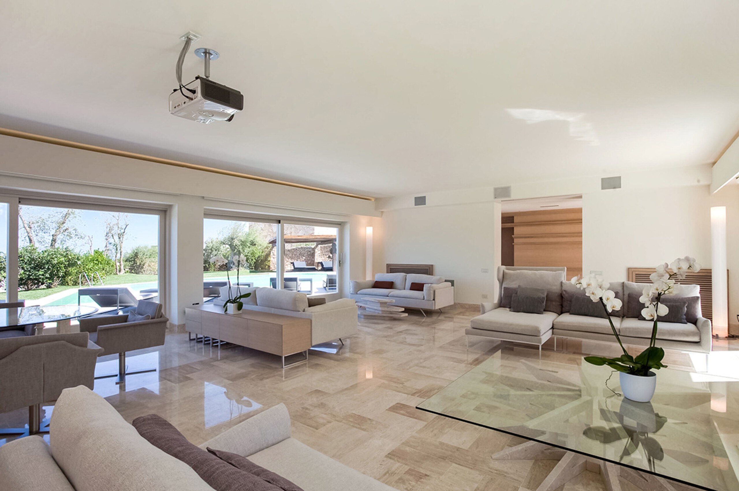 villa-mia-livingroom-lounge-spacious-openplan-poolview-modern-elegant-luxury-sardinia