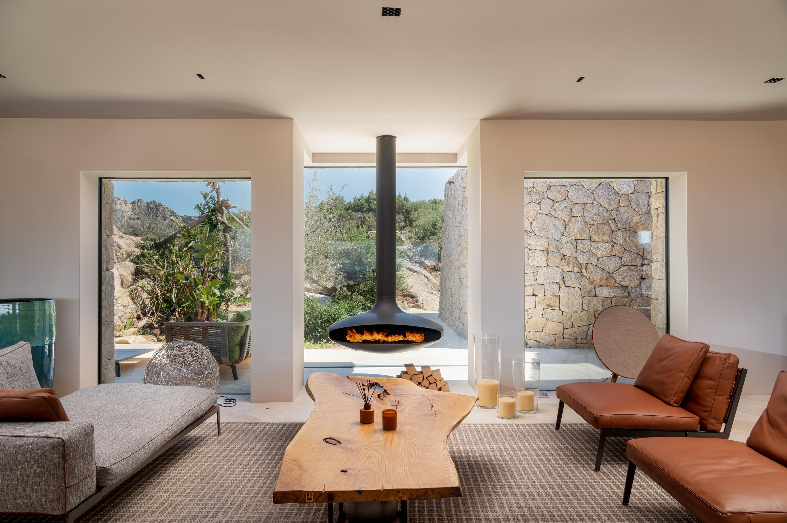 villa-miliania-livingroom-fireplace-modern-stylish-interior-design-luxury-desert-mountain-retreat-sardinia