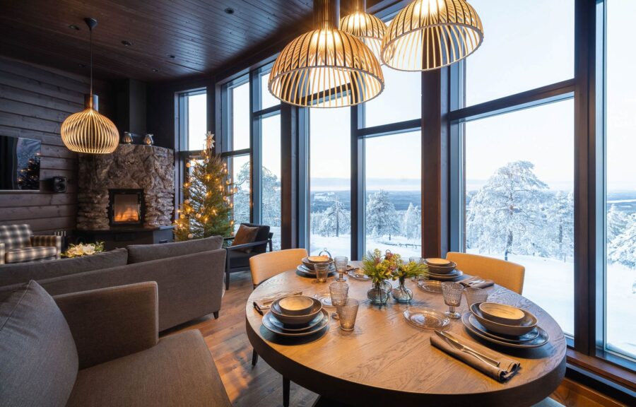 villa-octavia-living-area-dining-space-scenic-winter-views-cosy-fireplace-luxury-lapland