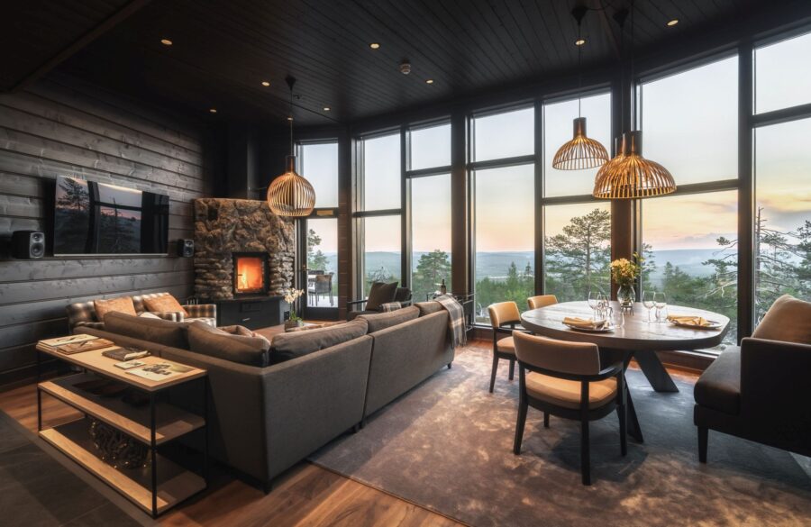 villa-octavia-livingroom-summer-fireplace-diningroom-openplan-scenic-views-luxury-rental-retreat-lapland