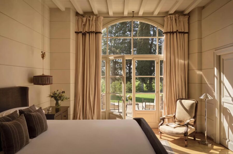 villa-odile-bedroom-garden-views-natural-sunlight-luxury-interior-design-tuscany
