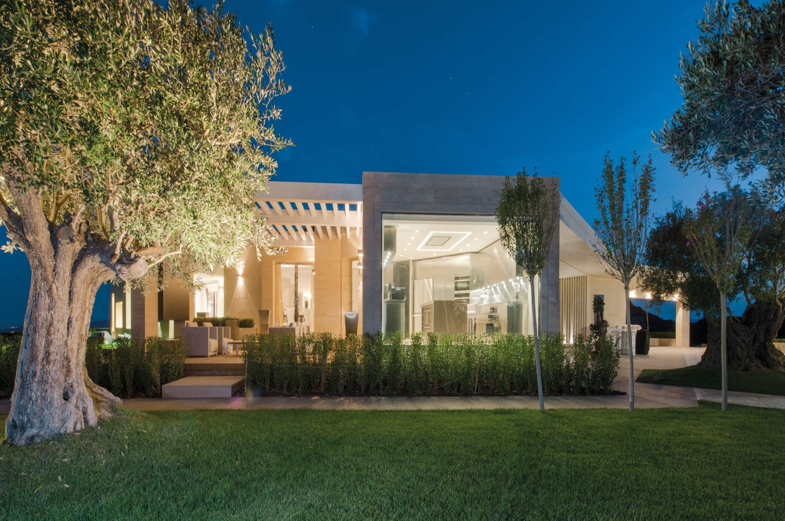 villa-paola-exterior-night-garden-paradise-seaview-luxury-rental-property-sardinia