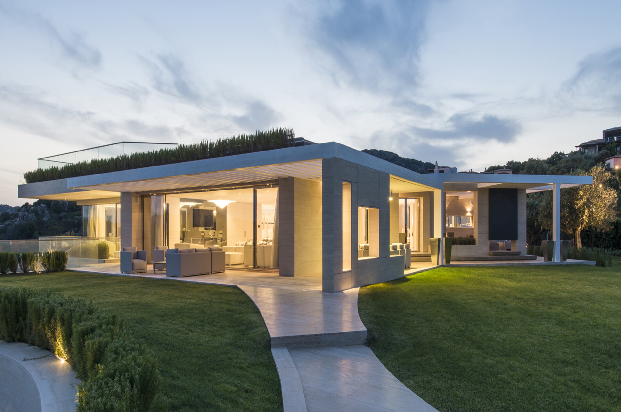 villa-paola-mainpage-exterior-garden-night-luxury-rental-property-sardinia