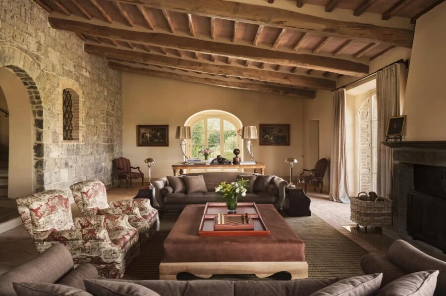 villa-selena-living-room-fireplace-wood-beamed-ceilings-elegant-interior-design-luxury-tuscany