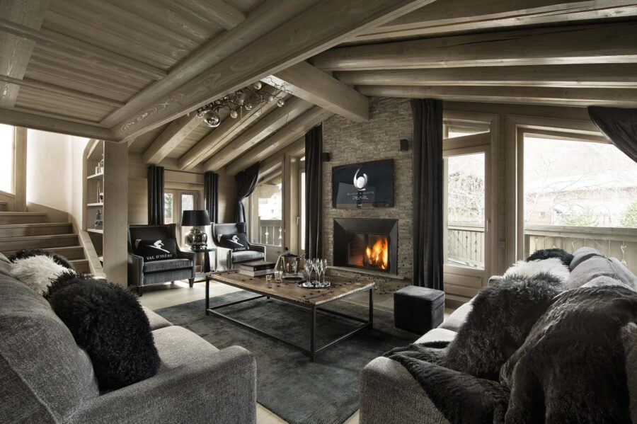 chalet-blair-mainpage-living-room-lounge-fireplace-scenic-views-luxury-alpine-interiors-vald'isere