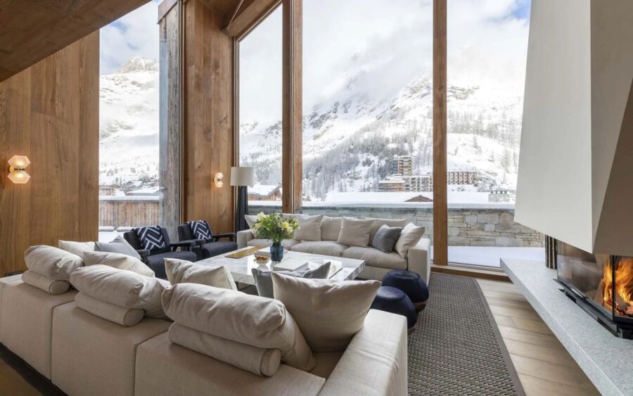 chalet-esme-living-room-lounge-scenic-mountain-views-fireplace-luxury-alpine-interiors-vald'isere