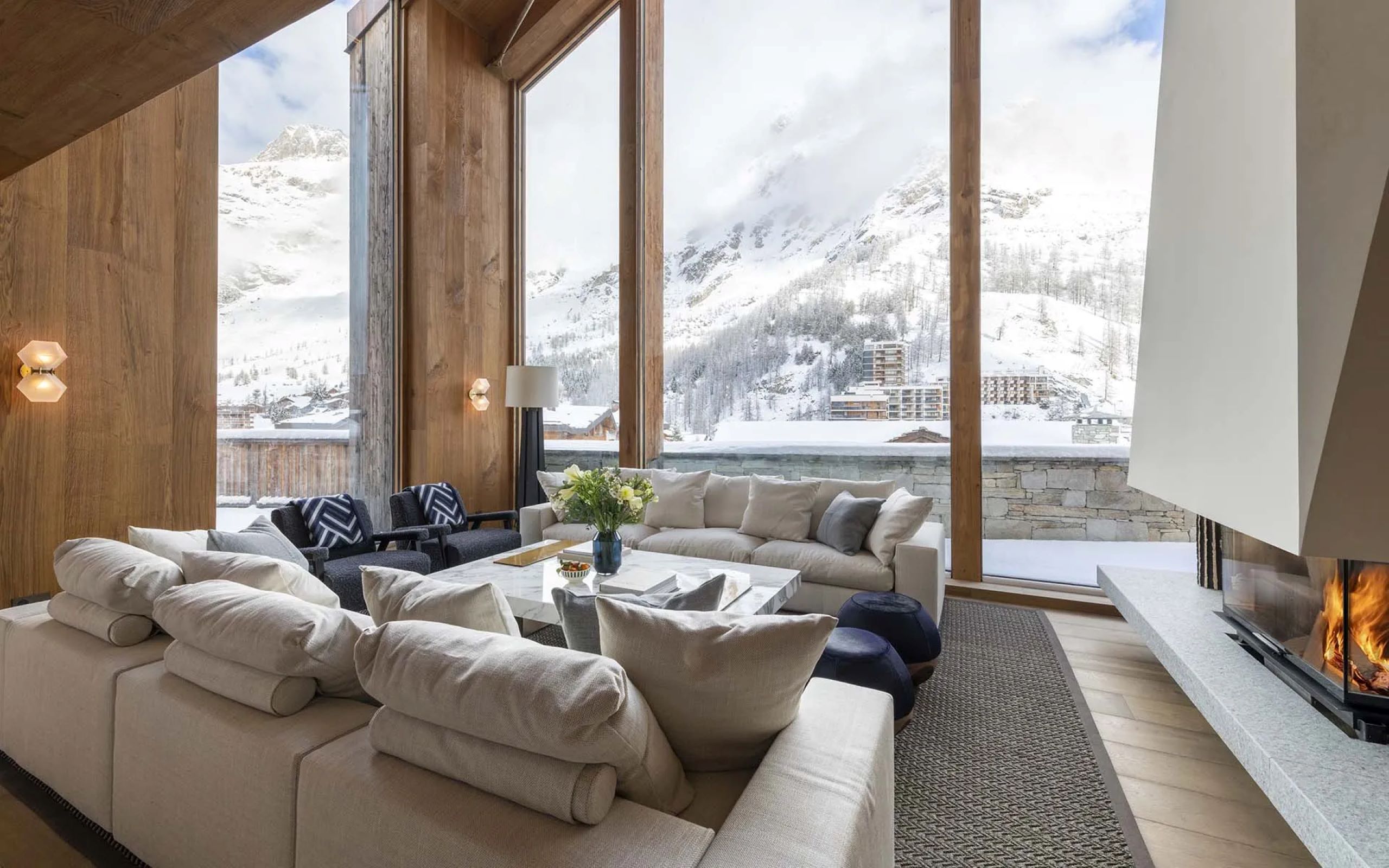 chalet-esme-living-room-lounge-scenic-mountain-views-fireplace-luxury-alpine-interiors-vald'isere