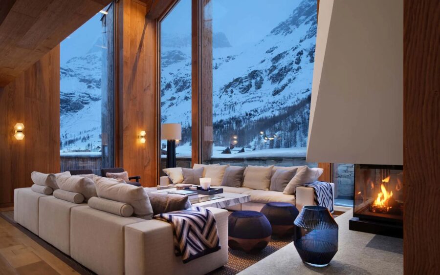 chalet-esme-livingroom-lounge-stunning-mountain-views-fireplace-heigh-ceilings-luxury-alpine-interiors-vald'isere
