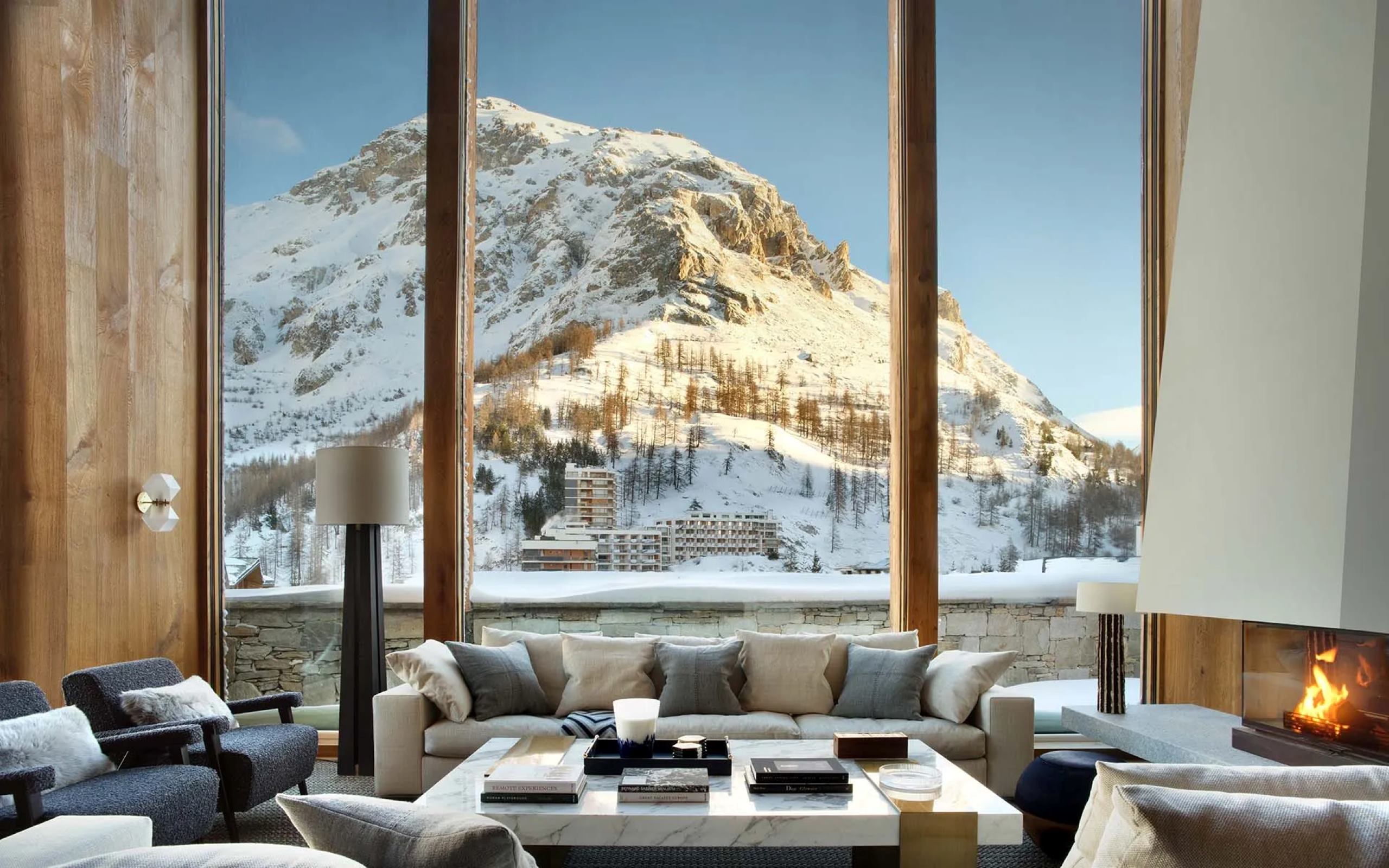 chalet-esme-mainpage-living-room-stunning-mountain-views-fireplace-modern-luxury-rental-retreat-vald'isere