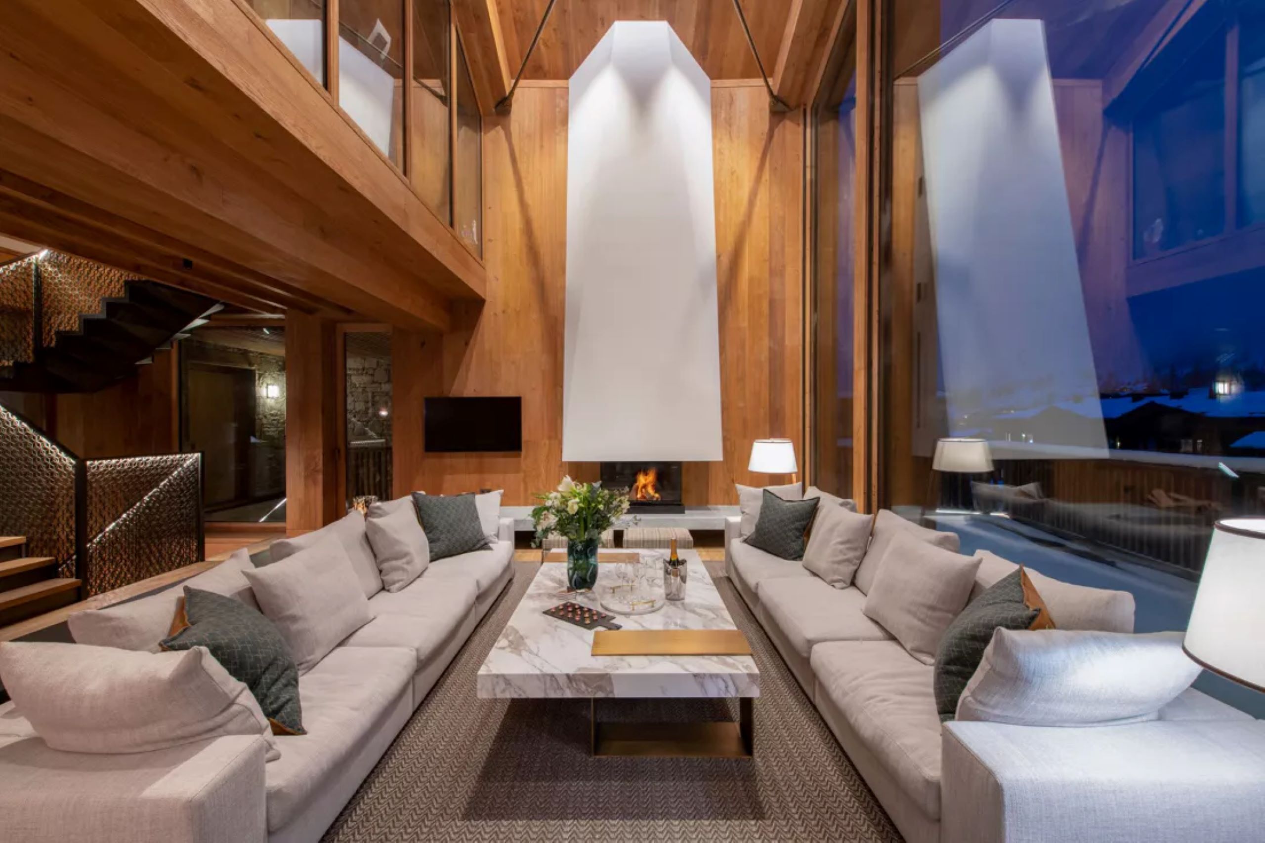 chalet-eva-living-room-fireplace-mountain-view-elegant-modern-alpine-design-luxury-interior-vald'isere