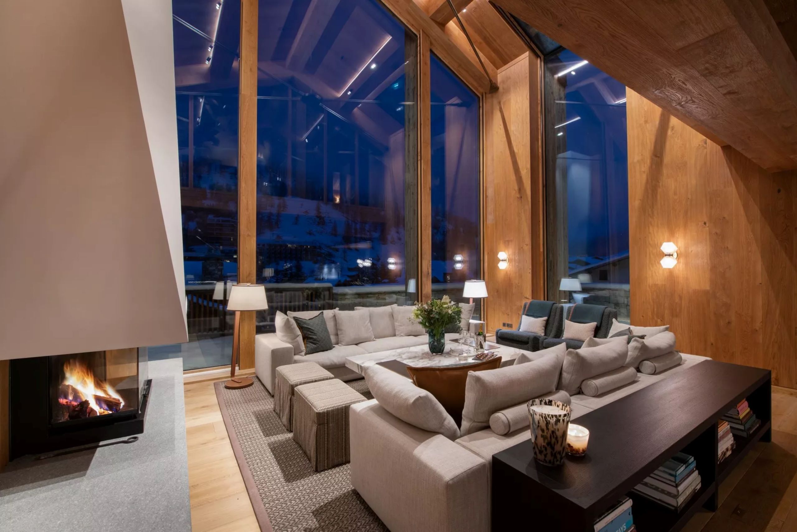 chalet-eva-livingroom-lounge-mountain-views-fireplace-sleek-modern-elegant-interiors-luxury-vald'isere
