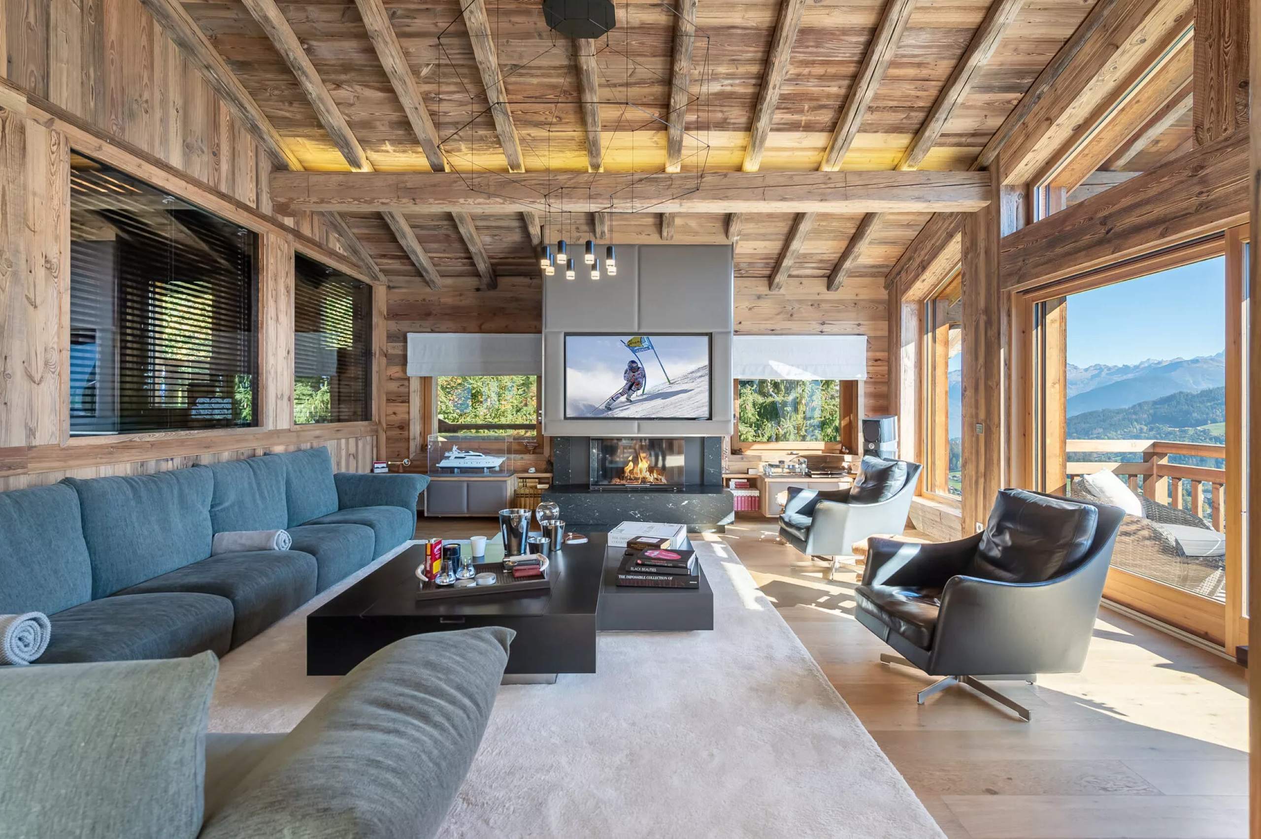 chalet-hollie-livingroom-spacious-fireplace-alpine-views-elegant-design-luxury-megeve