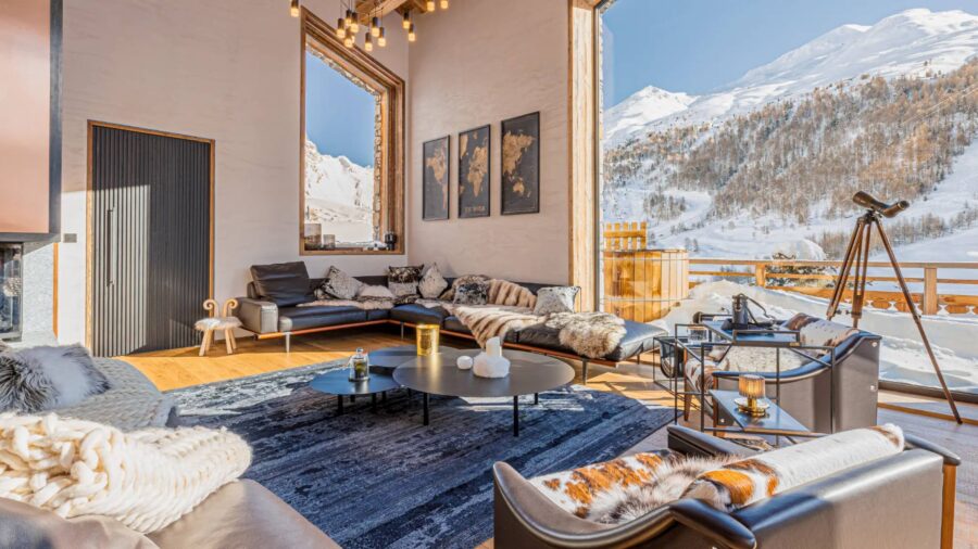 chalet-lyla-mainpage-living-room-lounge-stunning-mountain-landscape-views-charming-elegant-alpine-interiors-luxury-retreat-vald'isere