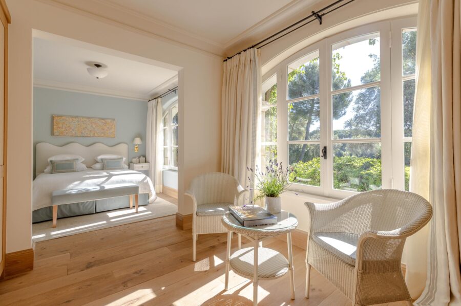 villa-delphine-bedroom-lounge-area-stunning-garden-views-elegant-interiors-luxury-cap-d'antibes