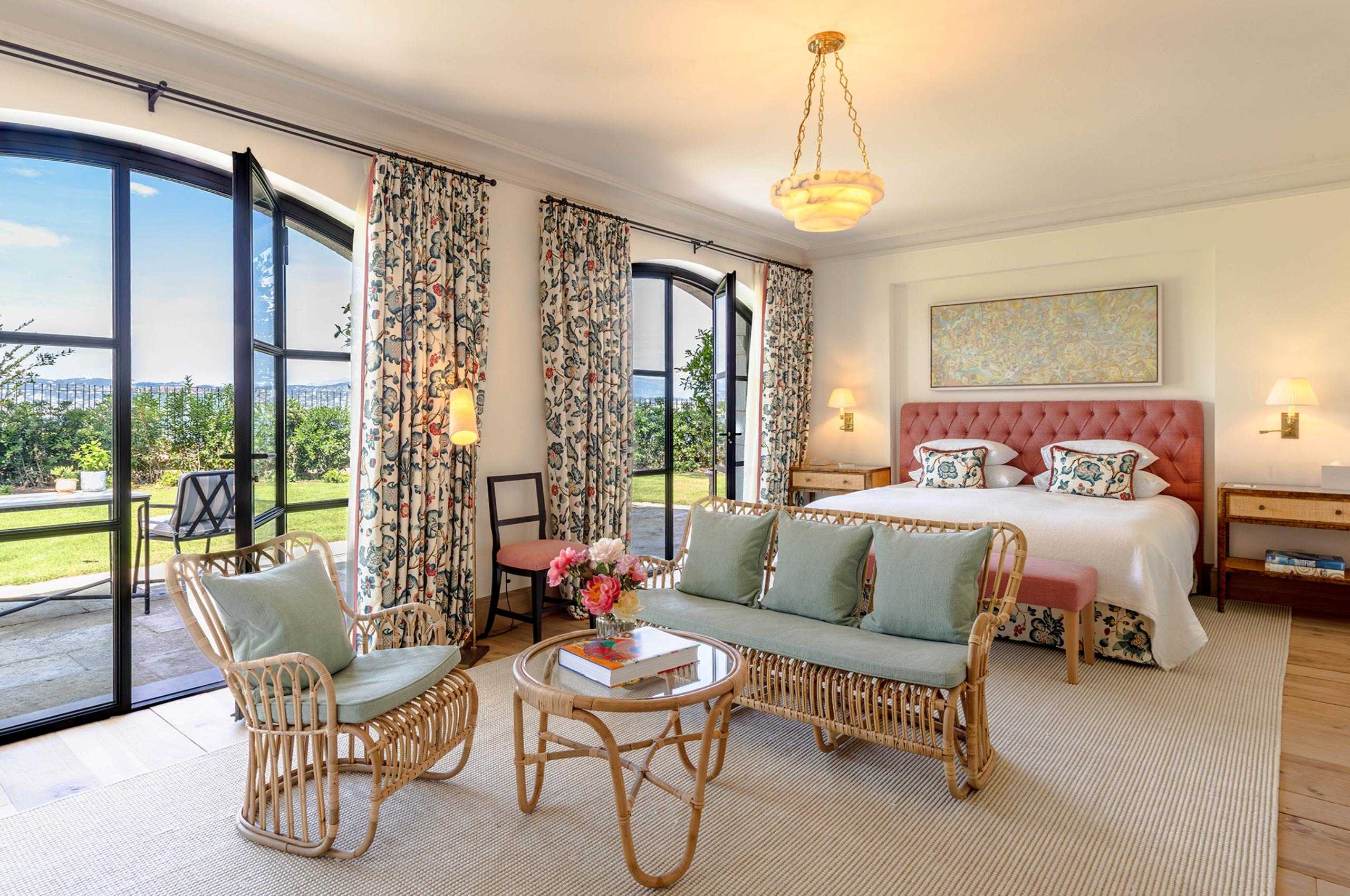 villa-delphine-bedroom-lounge-area-terrace-access-garden-view-elegant-whimsical-style-luxury-cap-d'antibes