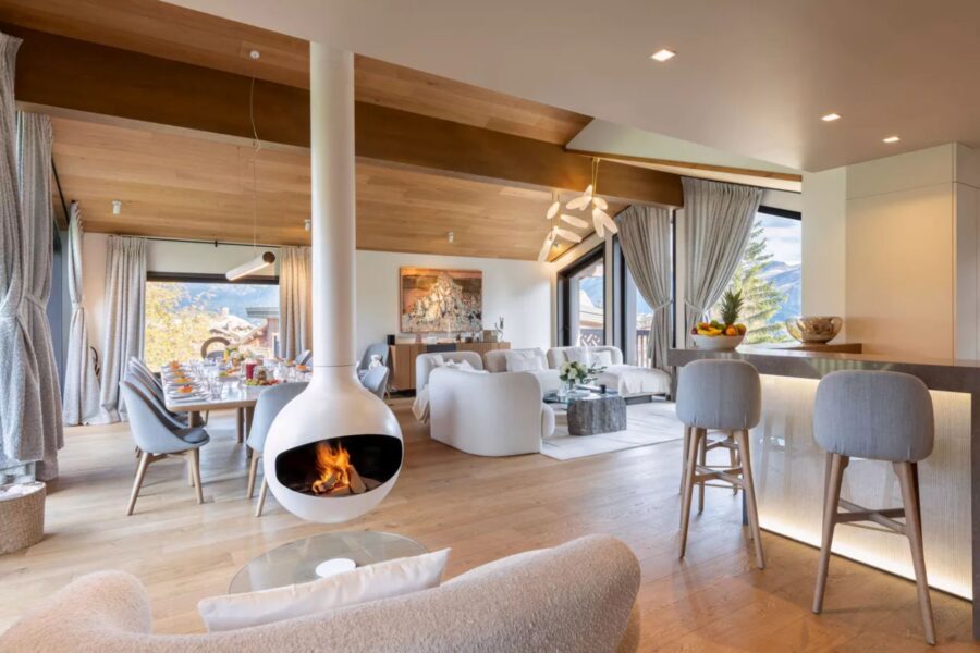 chalet-adele-livingroom-fireplace-bar-diningroom-openplan-sleek-modern-design-luxury-courchevel1650