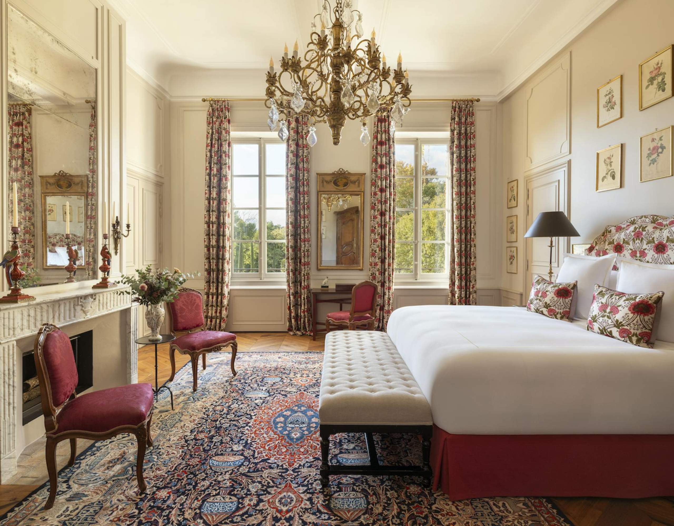 villa-esta-bedroom-elegant-bright-interiors-grand-chandelier-fireplace-opulent-design-luxury-provence