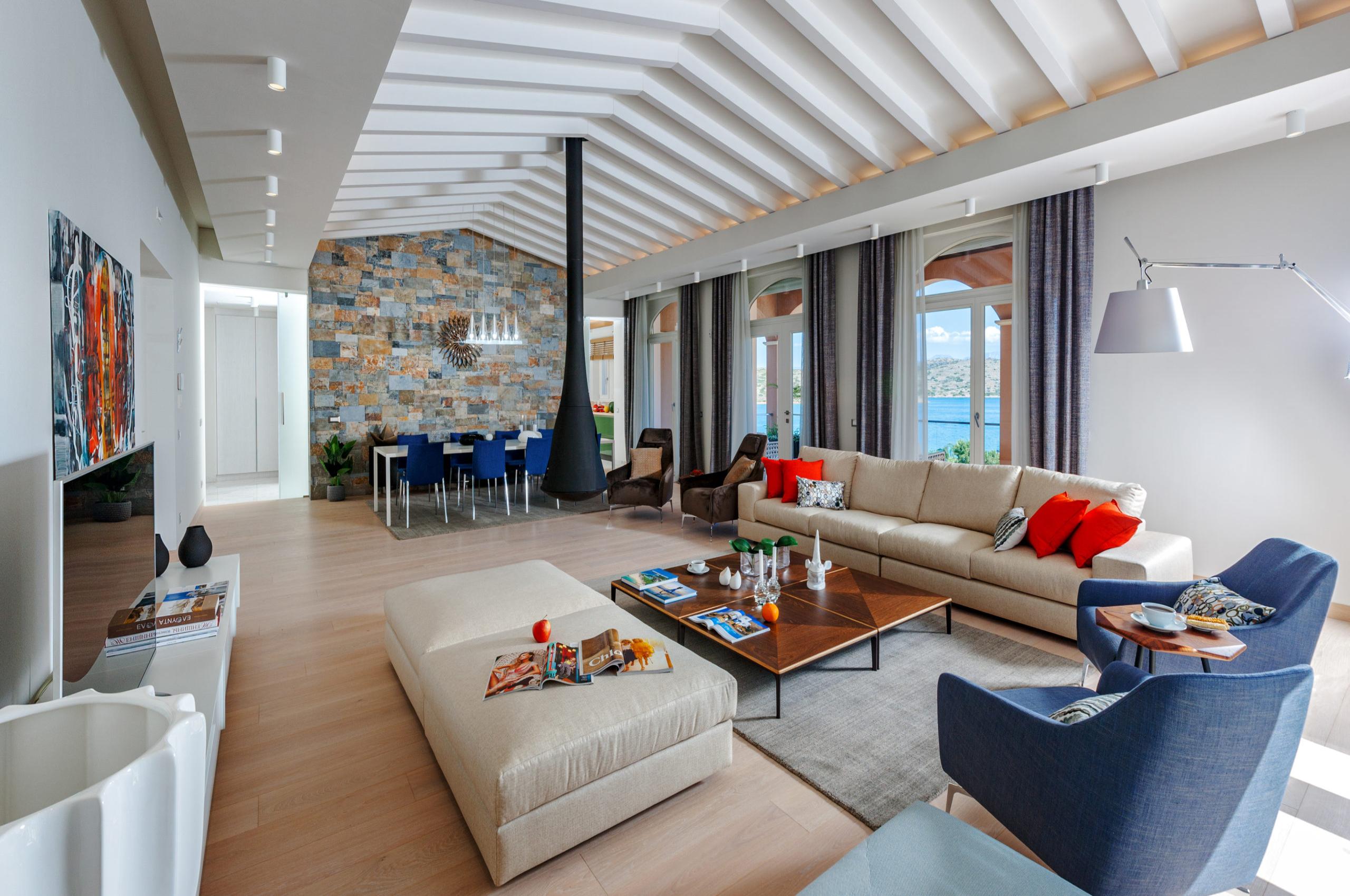 villa-octavia-living-room-dining-room-sea-view-hanging-fireplace-spacious-luxury-crete