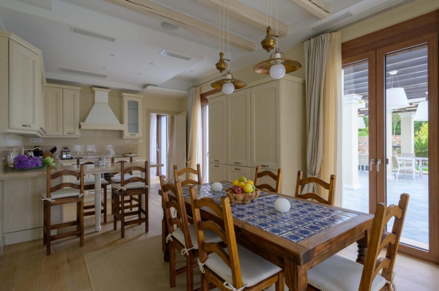 villa-una-kitchen-dining-table-terrace-access-swimming-pool-views-luxury-crete