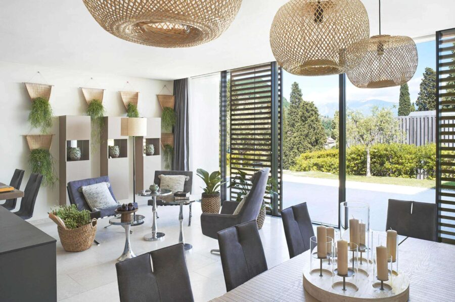 villa-leah-living-area-dining-table-garden-view-modern-stylish-design-luxury-lakegarda