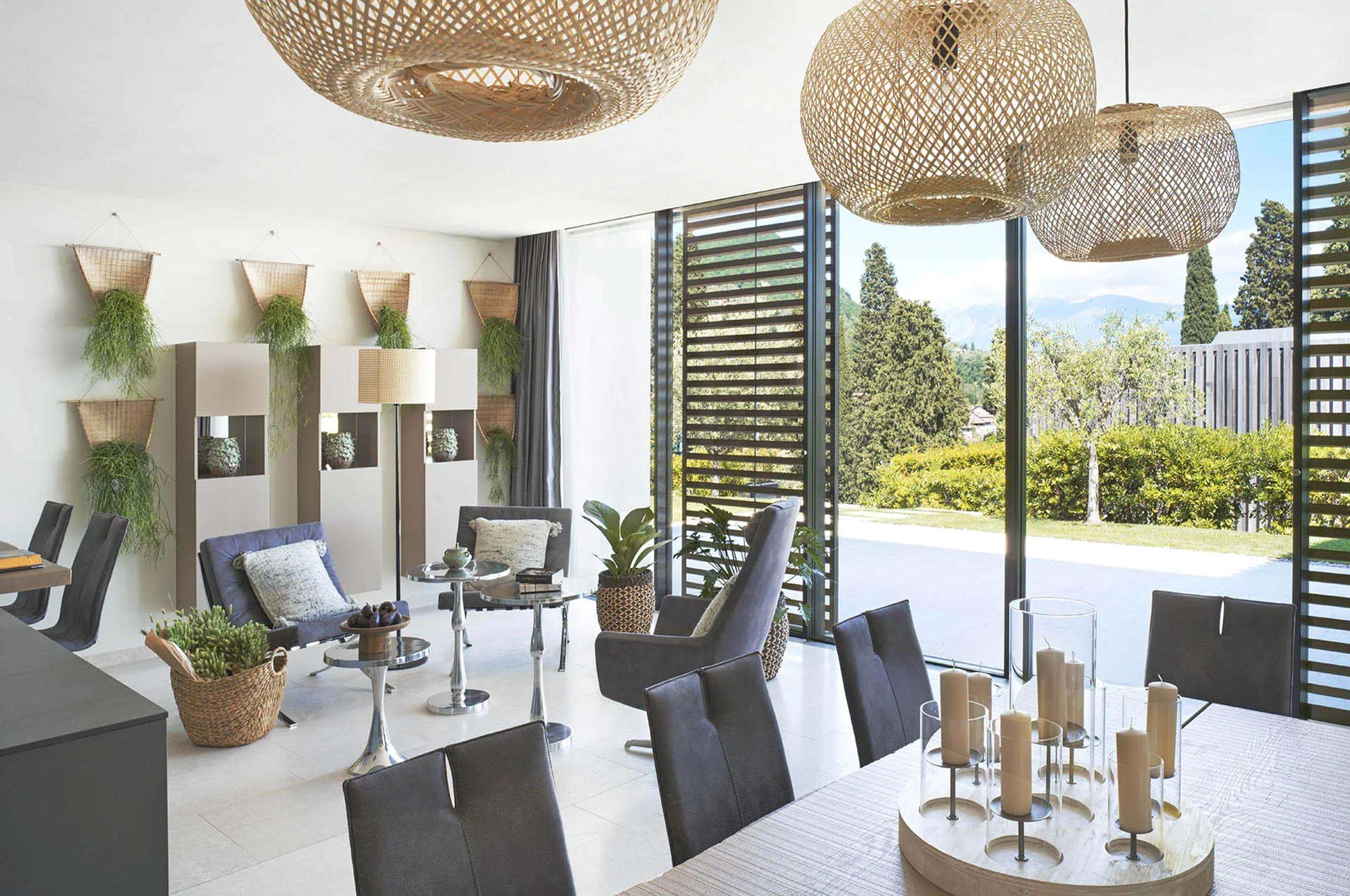 villa-leah-living-area-dining-table-garden-view-modern-stylish-design-luxury-lakegarda