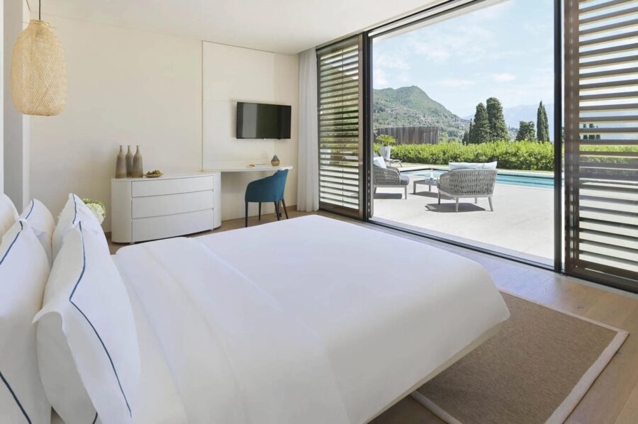 villa-luna-bedroom-pool-view-terrace-access-sleek-serene-design-luxury-lakegarda