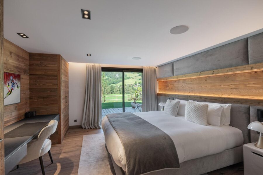 chalet-griselda-bedroom-scenic-alpine-views-elegant-design-luxury-megeve