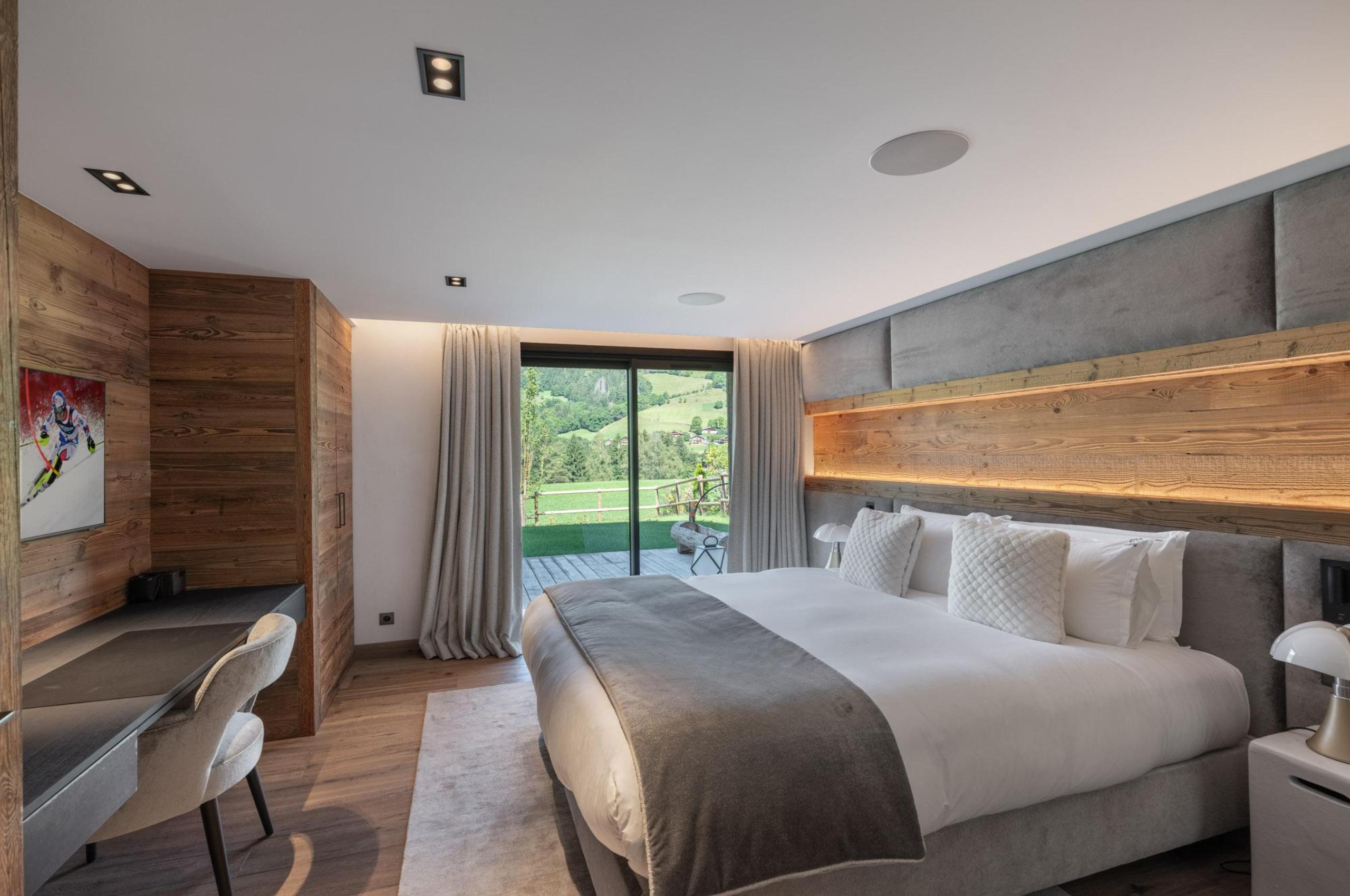 chalet-griselda-bedroom-scenic-alpine-views-elegant-design-luxury-megeve
