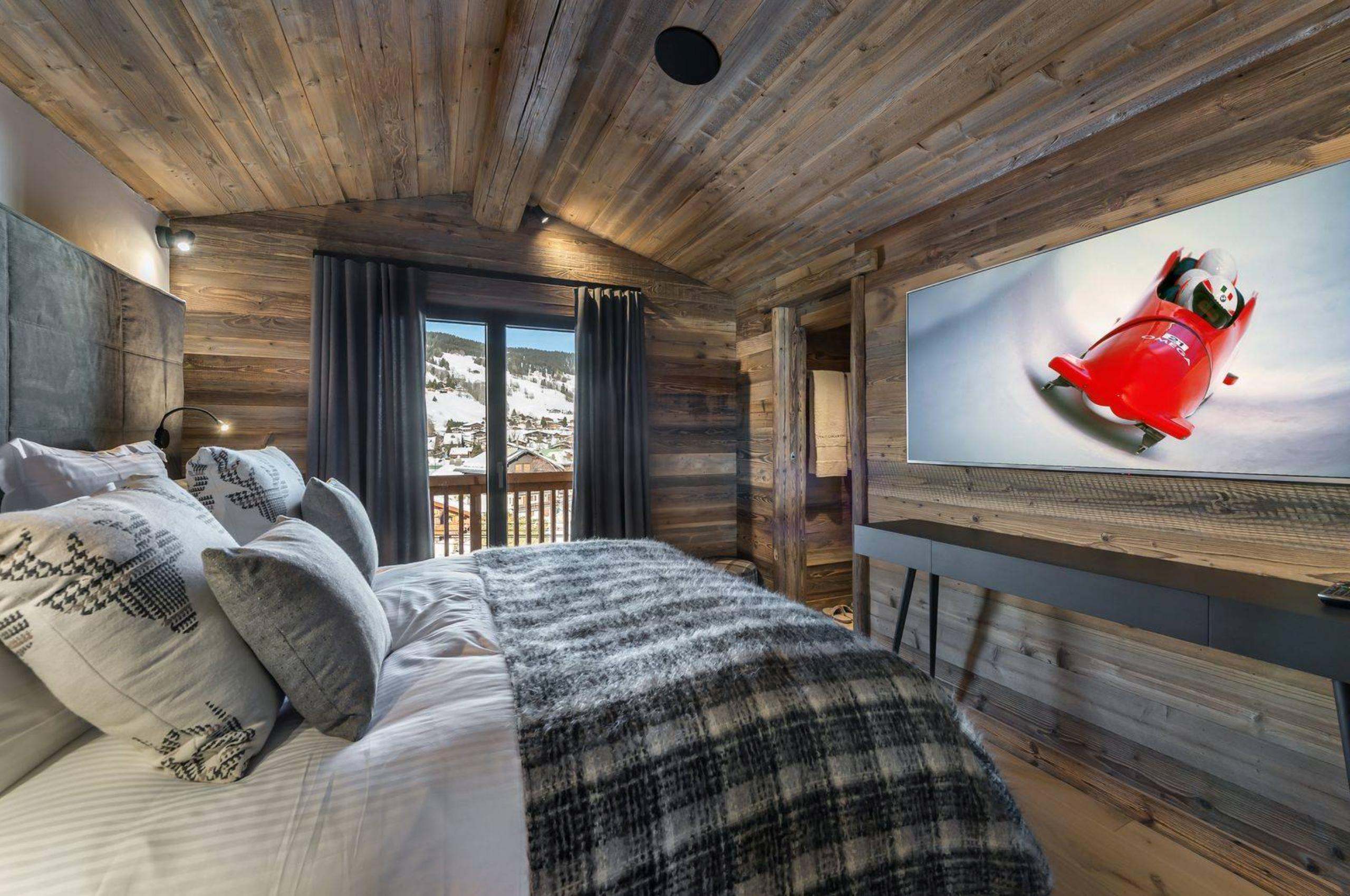 chalet-lara-bedroom-modern-alpine-interiors-tv-luxury-megeve