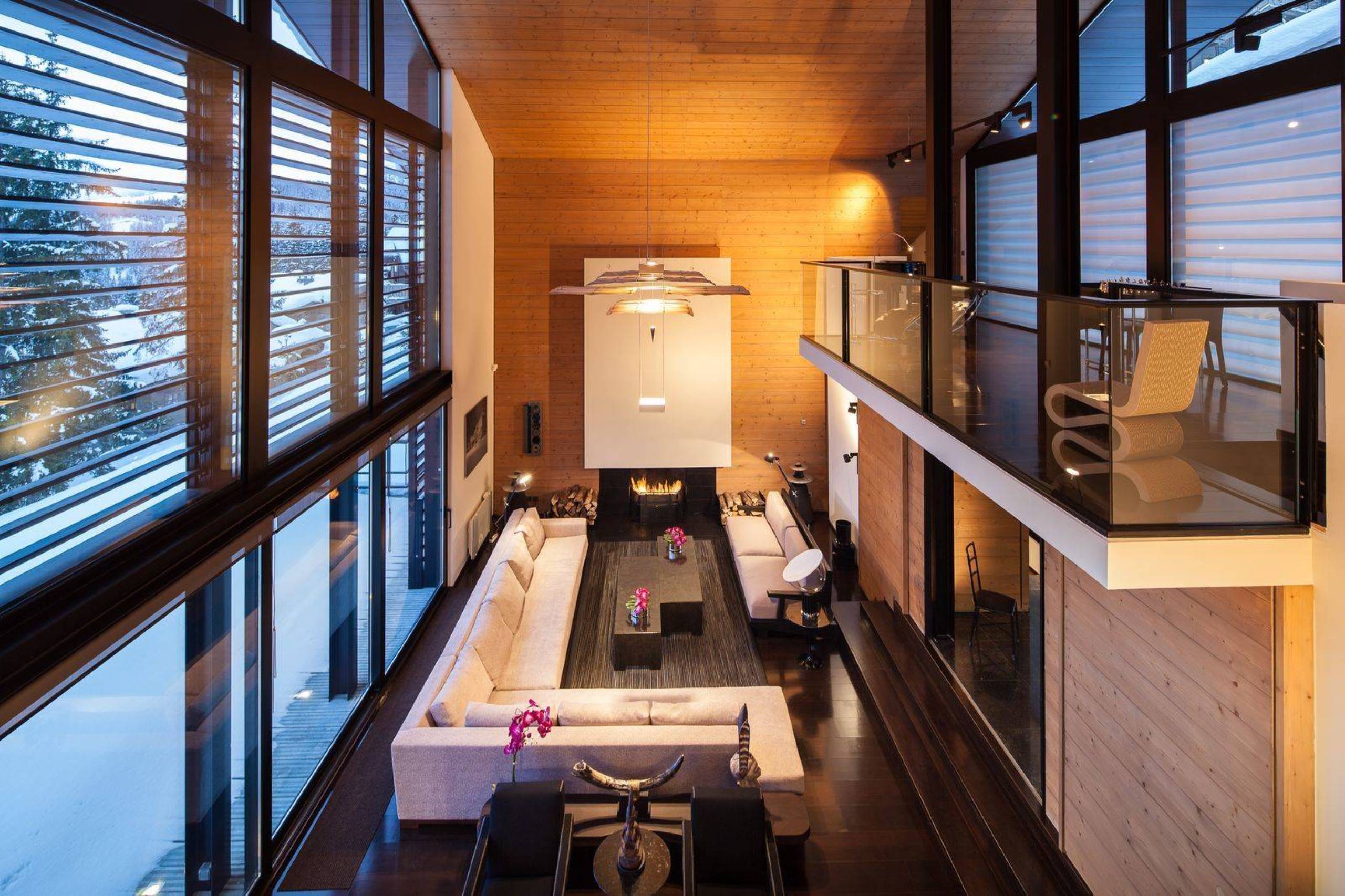 chalet-giselle-livingroom-mezzanine-fireplace-openplan-grand-stylish-luxury-interior-courchevel1850