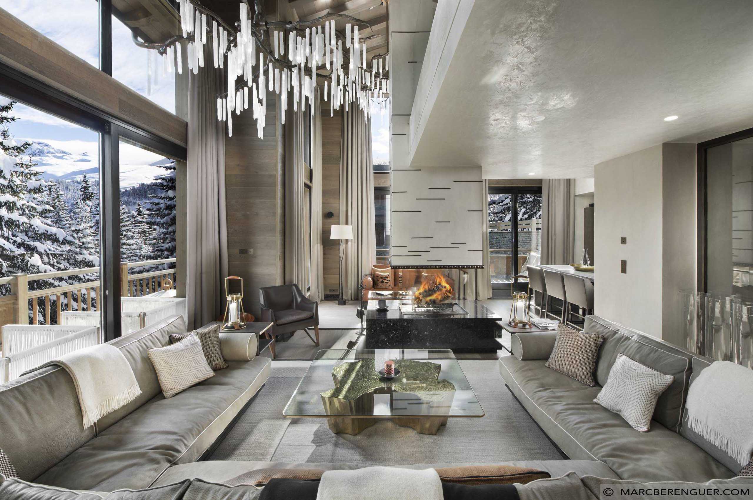 chalet-perce-mainpage-livingroom-mountainview-fireplace-spacious-openplan-modern-luxury-design-courchevel1850