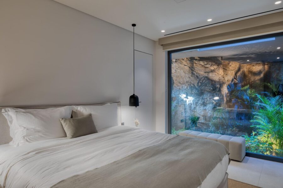 villa-august-bedroom-unique-rock-plant-display-luxury-interiors-mykonos