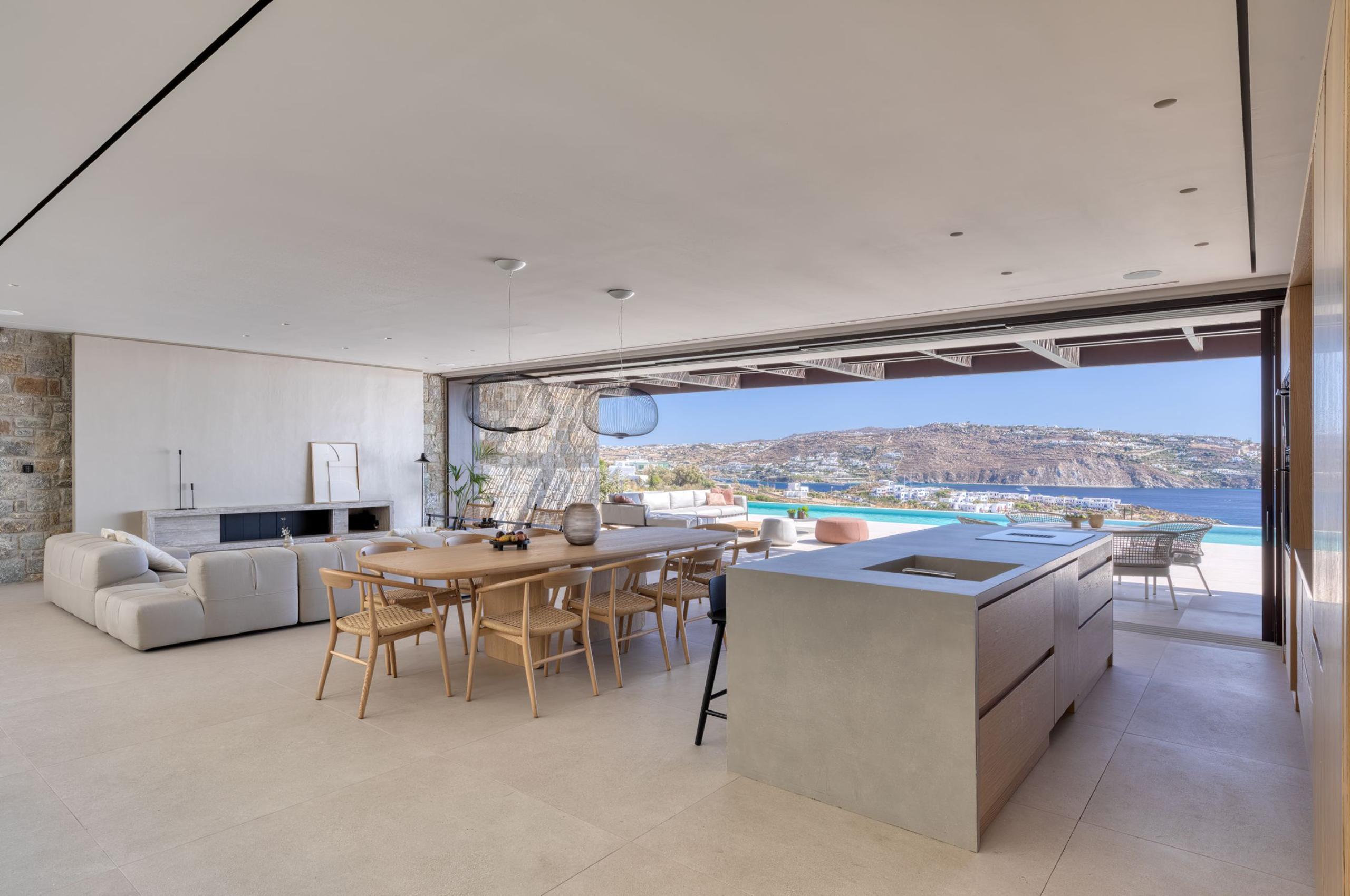 villa-august-living-area-kitchen-dining-lounge-openplan-sleek-modern-design-scenic-sea-views-luxury-mykonos