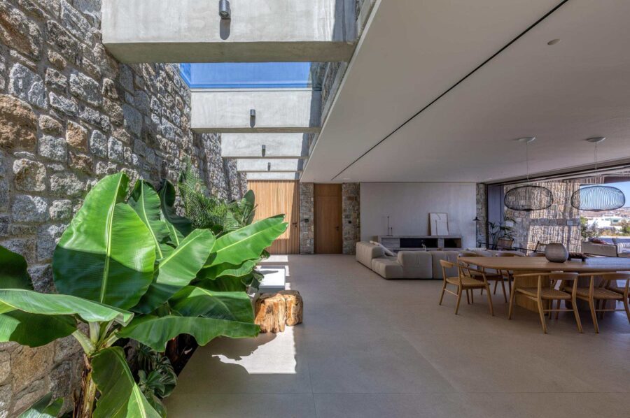 villa-august-living-room-dining-area-bright-glass-ceiling-modern-spacious-design-luxury-mykonos