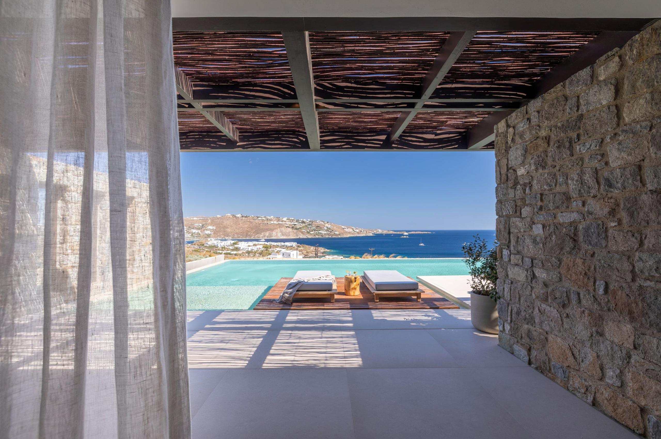 villa-august-terrace-sun-loungers-infinity-swimming-pool-sea-view-luxury-mykonos