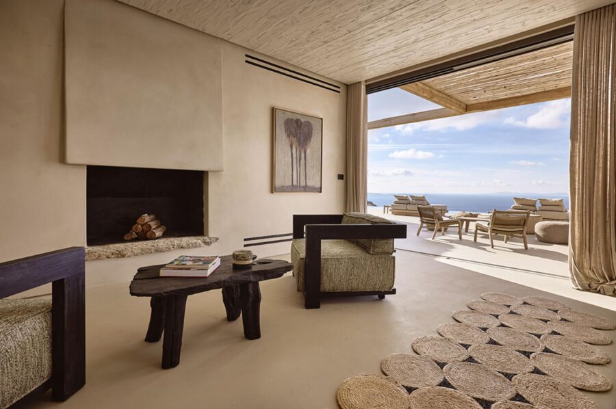 villa-daphne-living-room-fireplace-open-plan-sea-views-luxury-rental-retreat-mykonos