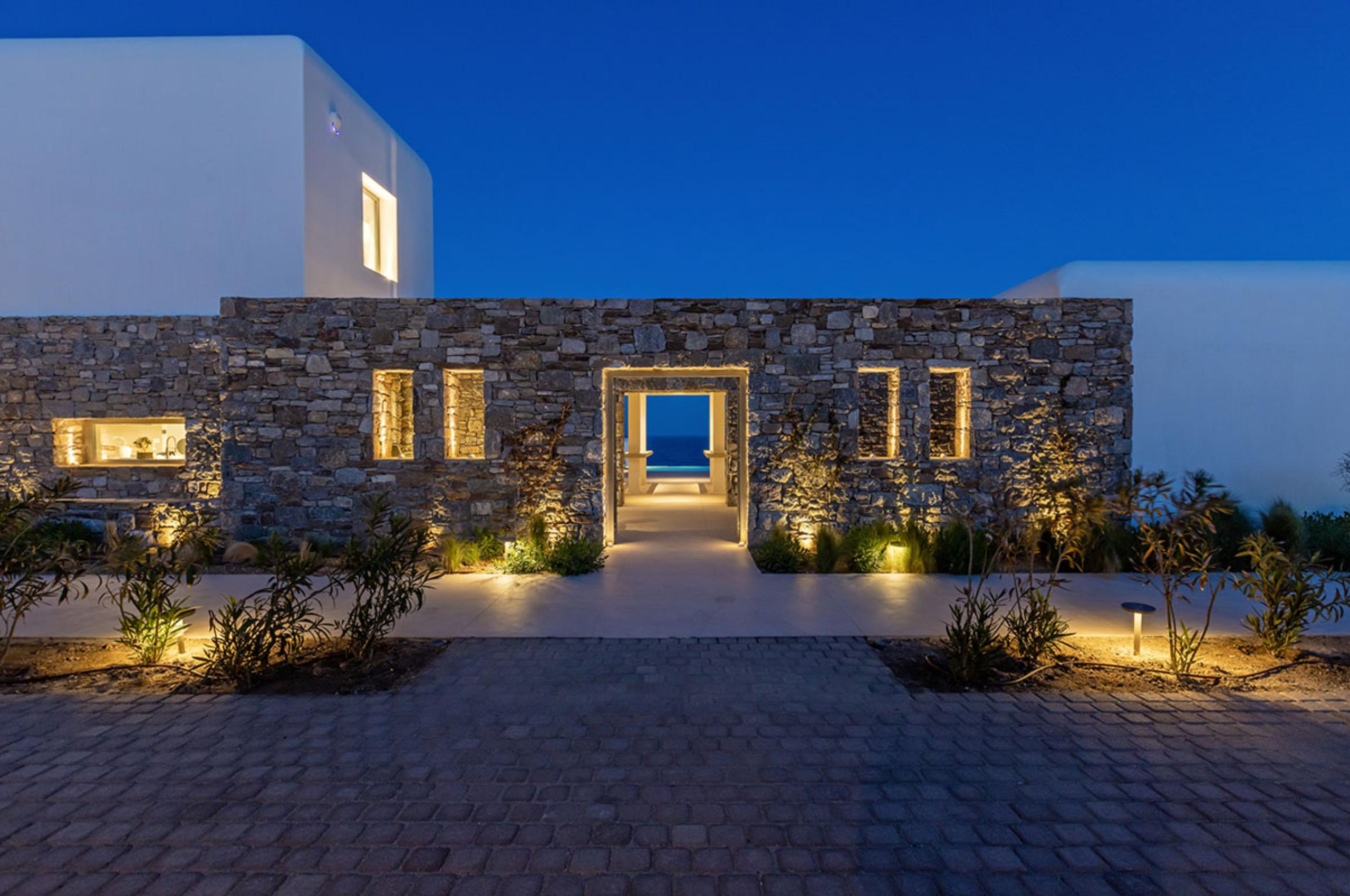 villa-diana-entrance-night-sea-views-luxury-mediterranean-rental-retreat-mykonos