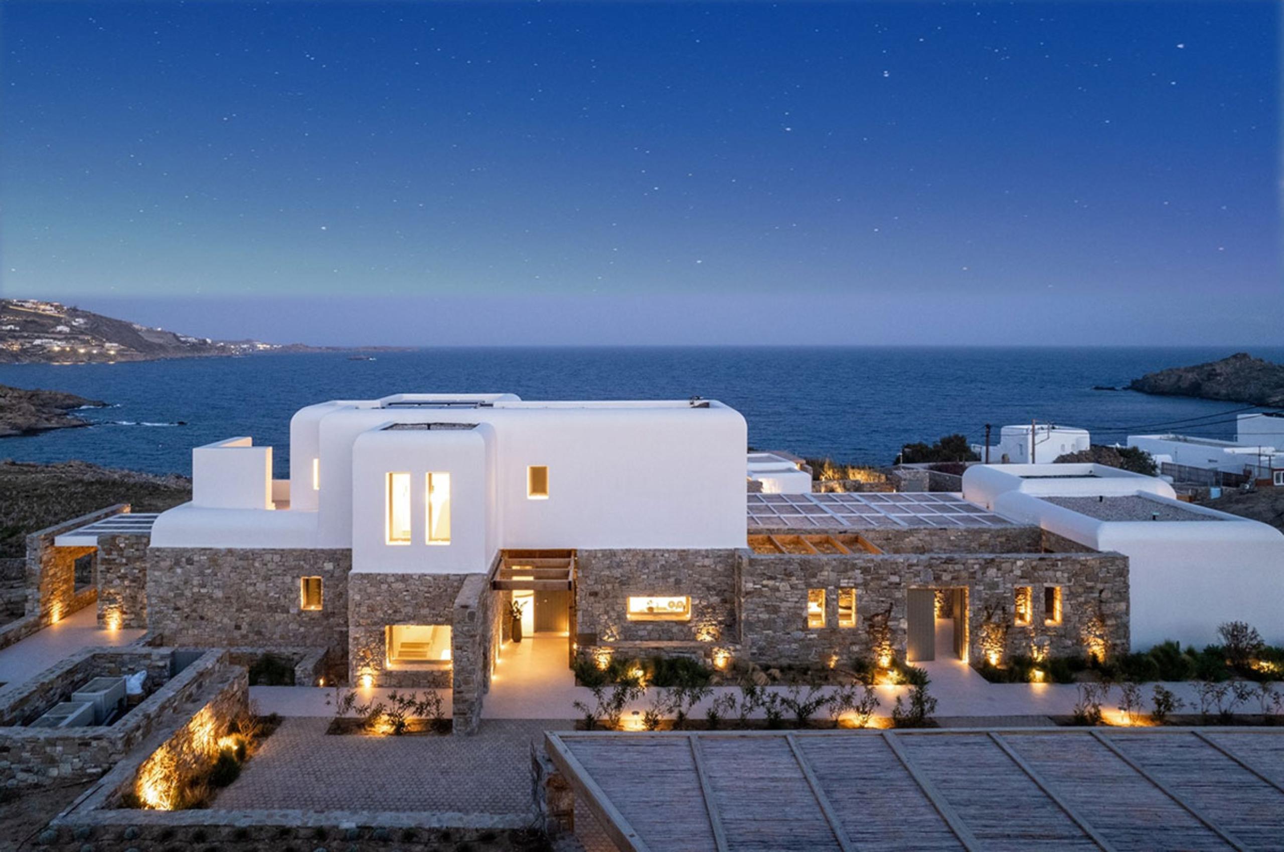villa-diana-exterior-sea-front-property-night-luxury-mediterranean-rental-retreat-mykonos