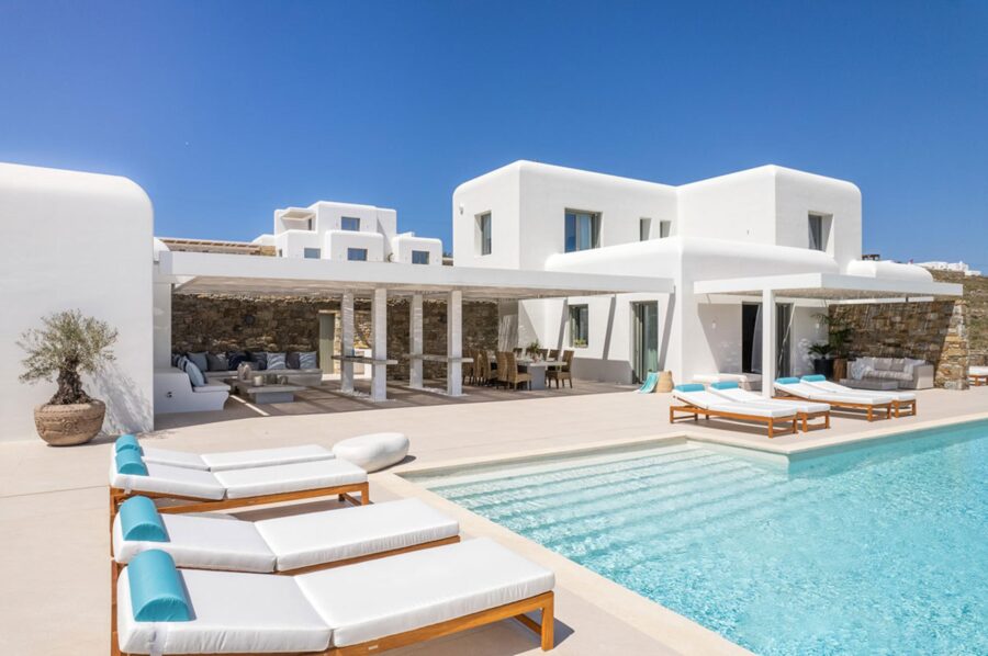 villa-diana-exterior-swimming-pool-sunbeds-terrace-outdoor-lounge-dining-area-luxury-mykonos