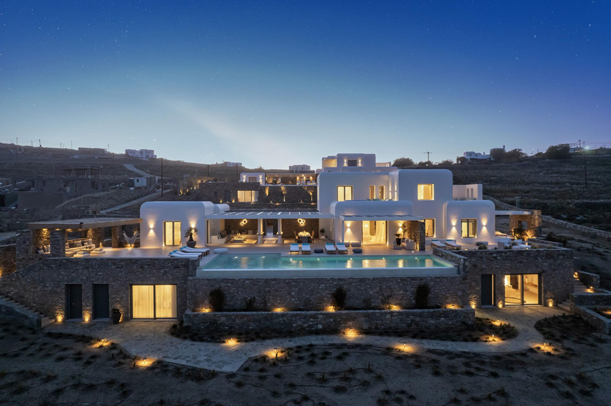 villa-diana-exterior-swimming-pool-terrace-night-luxury-mediterranean-rental-retreat-mykonos