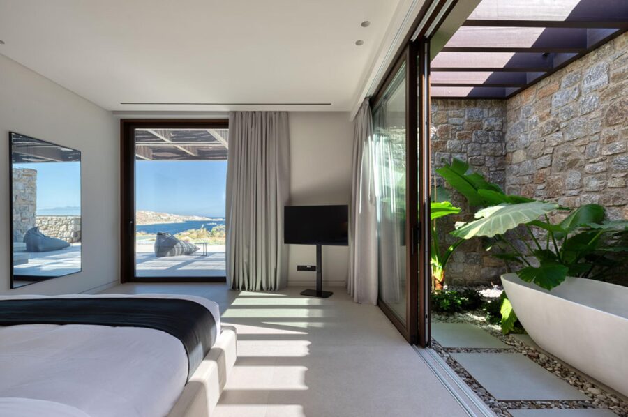 villa-lyra-bedroom-sea-view-ensuite-unqiue-design-bathtub-plants-wellness-luxury-mykonos