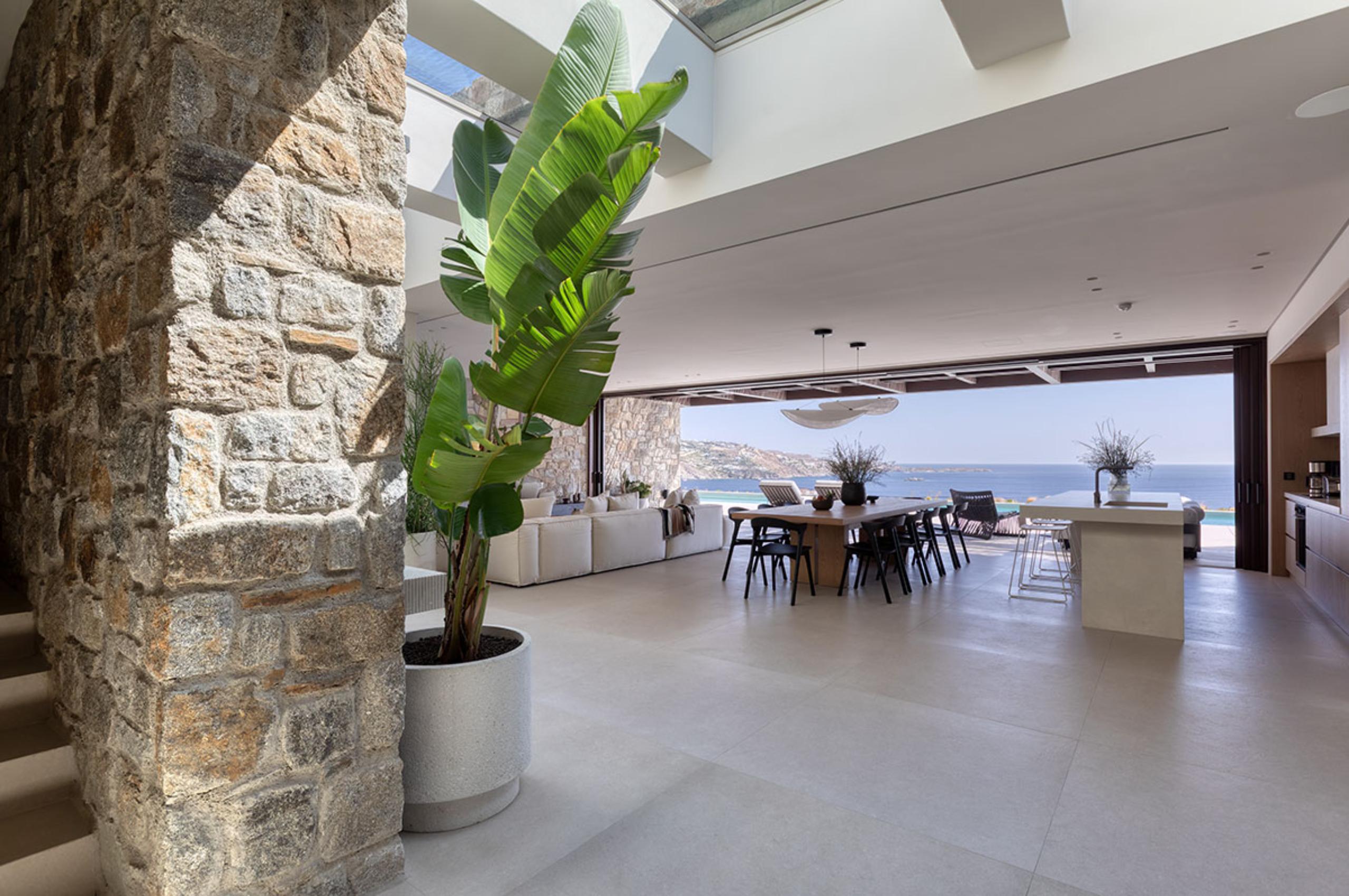 villa-lyra-living-area-openplan-kitchen-dining-lounge-sea-view-luxury-rental-retreat-mykonos